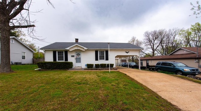 bungalow-style home with a front yard, central AC, a carport, a chimney, and driveway