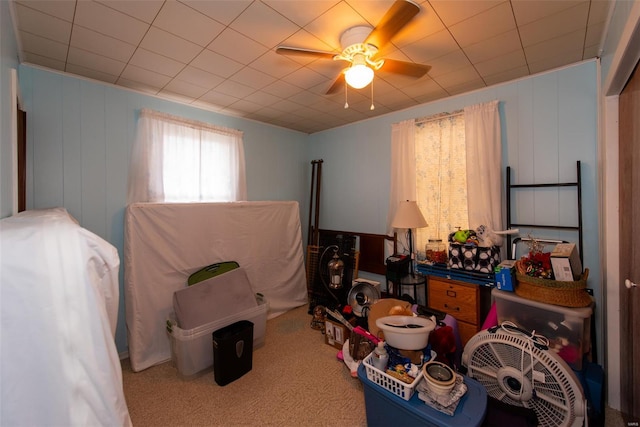 interior space featuring ceiling fan