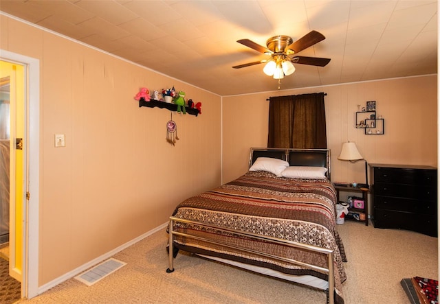 carpeted bedroom featuring visible vents and ceiling fan