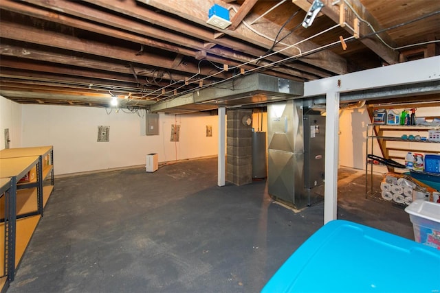 unfinished basement with electric panel, water heater, and heating unit