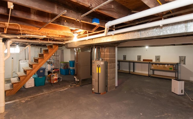 basement with water heater and stairs