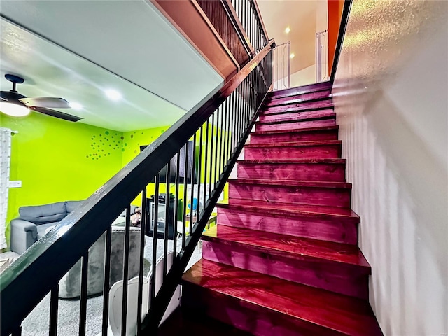 staircase with ceiling fan