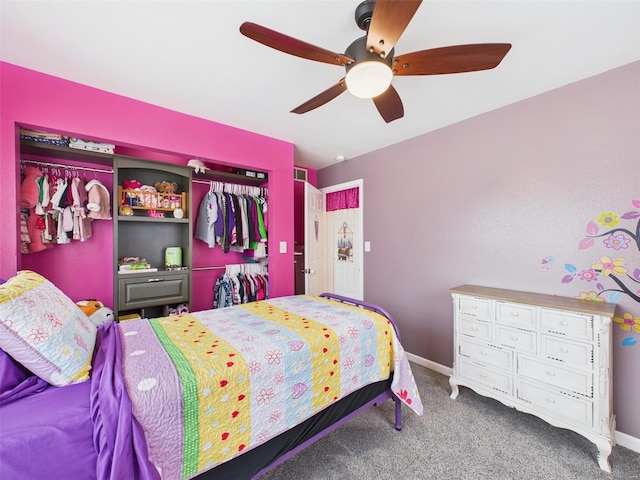 carpeted bedroom featuring a closet, ceiling fan, and baseboards