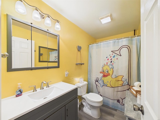 full bath featuring toilet, wood finished floors, vanity, and a shower with curtain