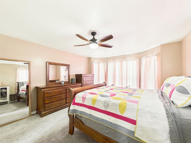 carpeted bedroom with a ceiling fan