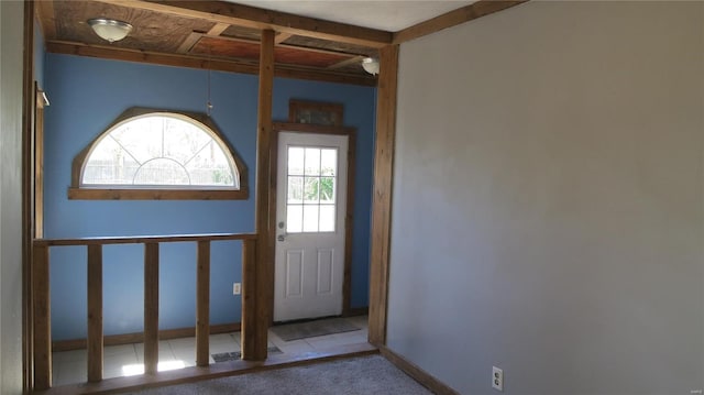 doorway featuring carpet floors