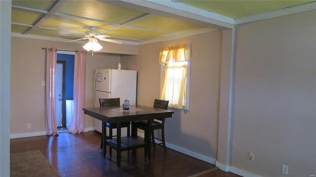 dining area with baseboards, a ceiling fan, and wood finished floors
