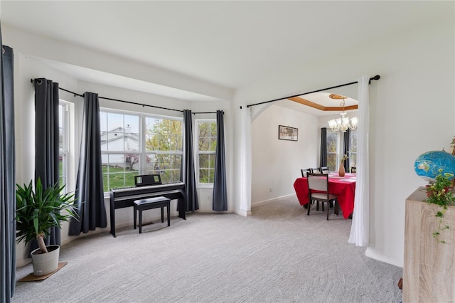 living area with a chandelier, arched walkways, baseboards, and carpet