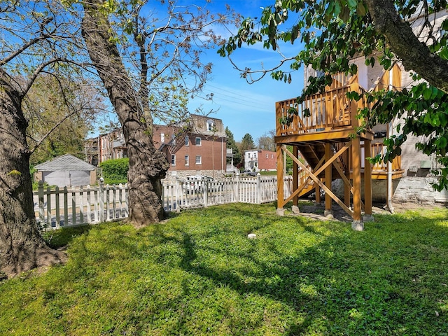 view of yard featuring a deck and a fenced backyard