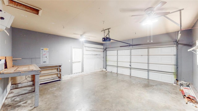 garage with a garage door opener and a ceiling fan