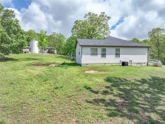 view of yard with central AC