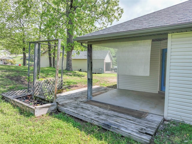 deck featuring a lawn