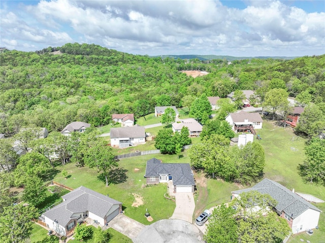 bird's eye view featuring a view of trees and a residential view