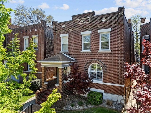 view of front of property featuring brick siding