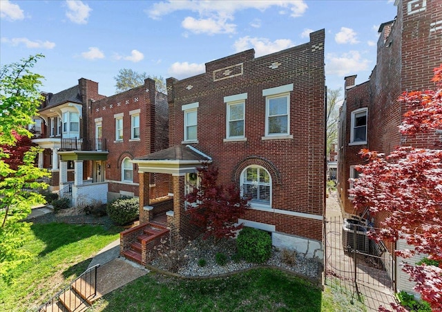 view of property with brick siding
