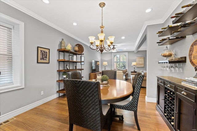 dining area featuring a chandelier, light wood-style floors, baseboards, visible vents, and recessed lighting