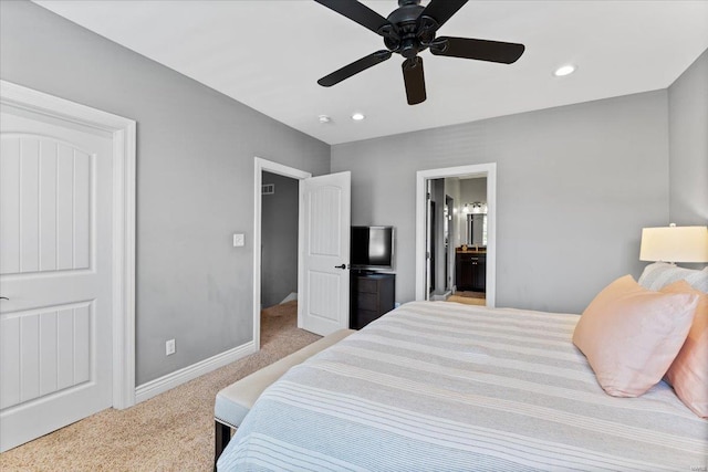 bedroom with recessed lighting, carpet floors, baseboards, and connected bathroom