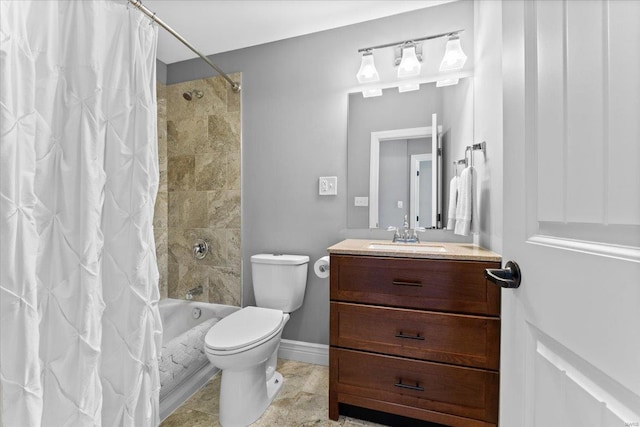 bathroom with baseboards, shower / bath combo, vanity, and toilet