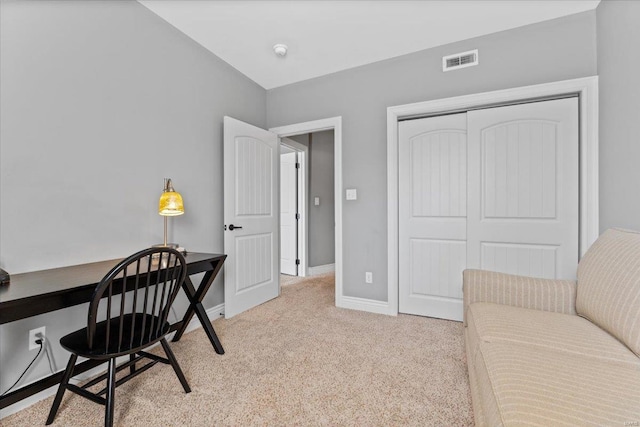 carpeted home office with baseboards and visible vents