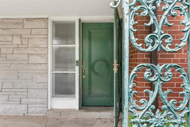 property entrance with brick siding
