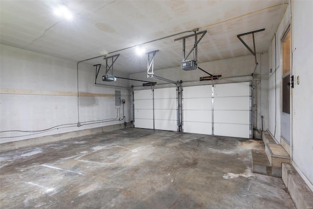 garage featuring a garage door opener and electric panel