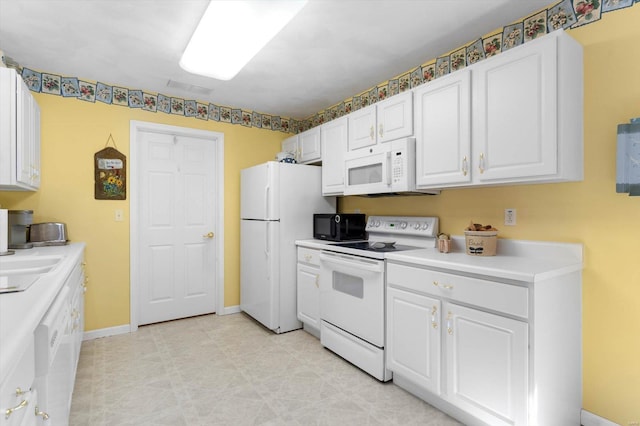 kitchen featuring white cabinets, baseboards, white appliances, and light countertops