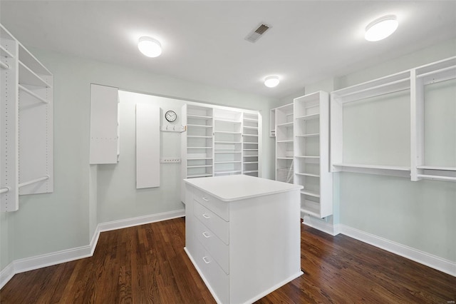 spacious closet with visible vents and dark wood-style floors