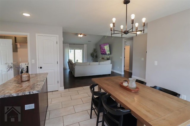 dining area featuring ceiling fan with notable chandelier, baseboards, recessed lighting, and light tile patterned floors