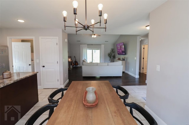dining space with baseboards, recessed lighting, a notable chandelier, and light tile patterned floors