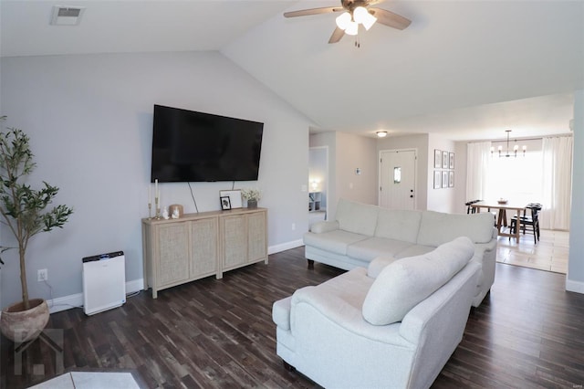 living area with vaulted ceiling, ceiling fan with notable chandelier, visible vents, baseboards, and dark wood-style floors