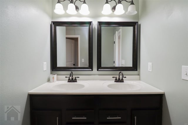bathroom featuring a sink and double vanity