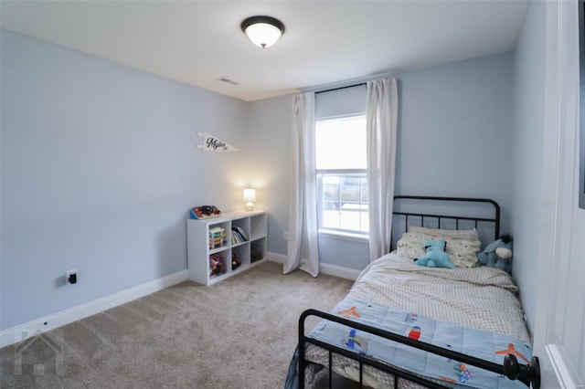 bedroom featuring carpet floors and baseboards