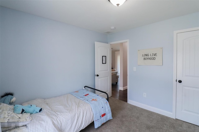carpeted bedroom with baseboards