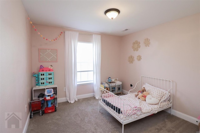 carpeted bedroom with baseboards and visible vents