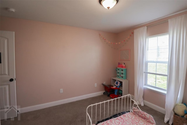 carpeted bedroom with baseboards