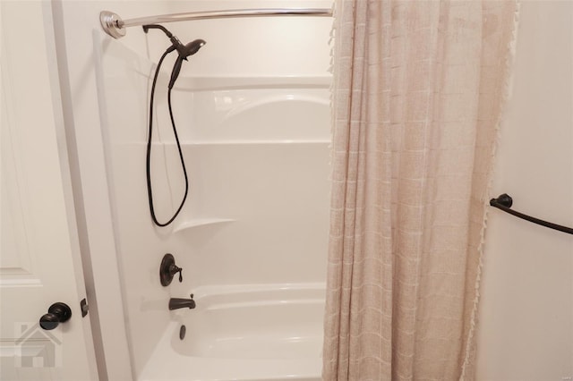 bathroom featuring shower / tub combo with curtain