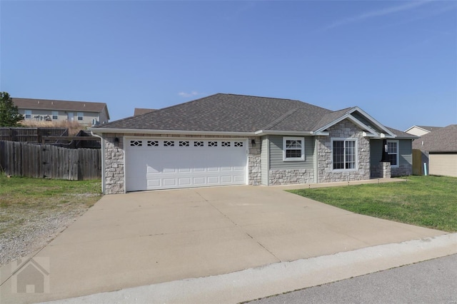 ranch-style house with roof with shingles, stone siding, concrete driveway, fence, and an attached garage
