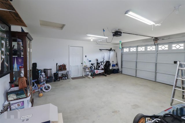 garage featuring a garage door opener