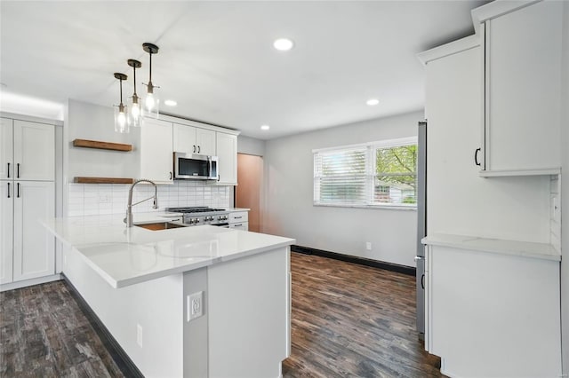 kitchen featuring stainless steel microwave, dark wood-style flooring, recessed lighting, backsplash, and open shelves