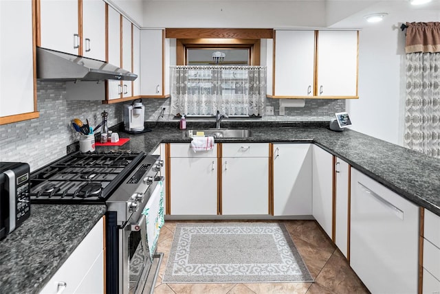 kitchen featuring dishwasher, stainless steel range with gas cooktop, white cabinetry, tasteful backsplash, and under cabinet range hood