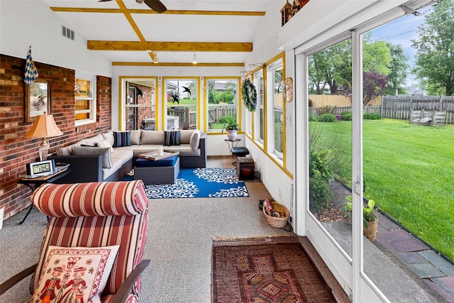 sunroom featuring carpet, beam ceiling, and visible vents