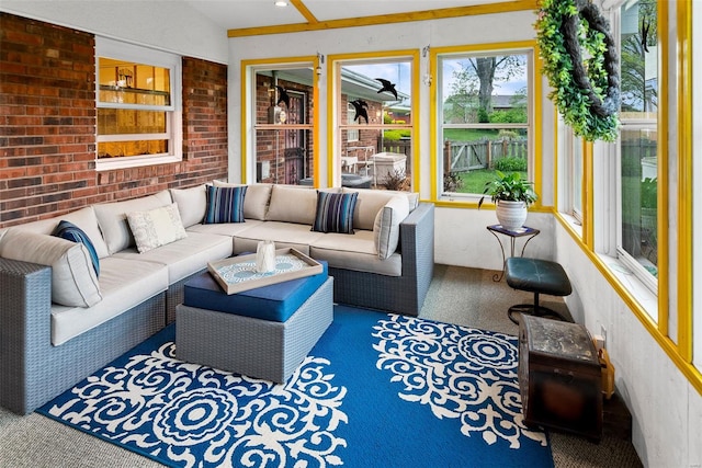 sunroom featuring an outdoor living space