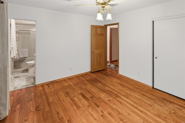 unfurnished bedroom featuring light wood-style floors, baseboards, a closet, and connected bathroom