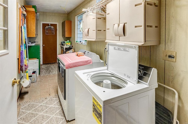 clothes washing area featuring washer and dryer