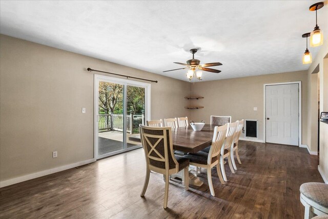 dining room with baseboards, ceiling fan, and dark wood finished floors