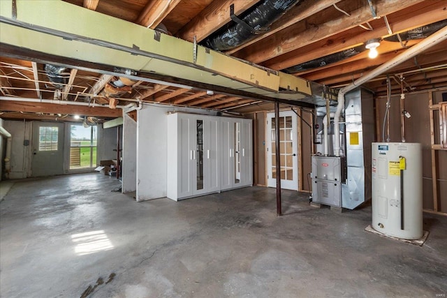 basement featuring water heater and heating unit