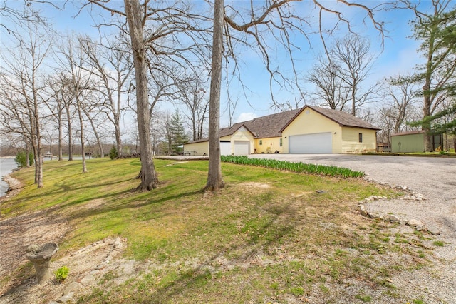 view of front of house with a front yard and driveway