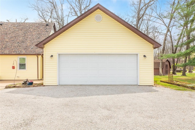 garage featuring driveway