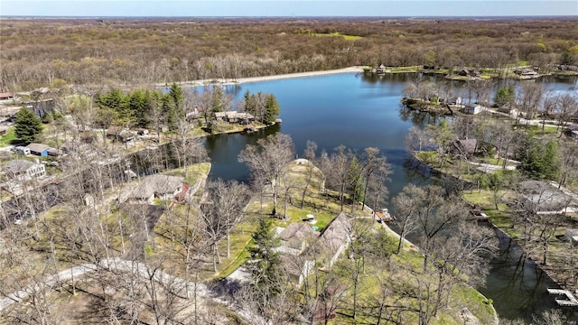 aerial view with a forest view and a water view