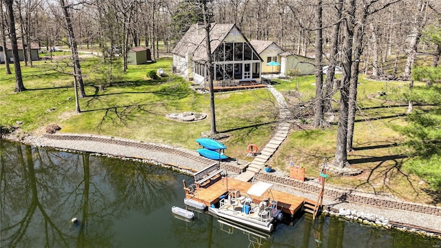 birds eye view of property with a water view
